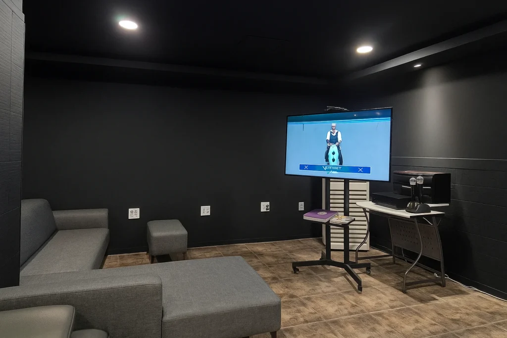 Karaoke setup with TV and sofa seating