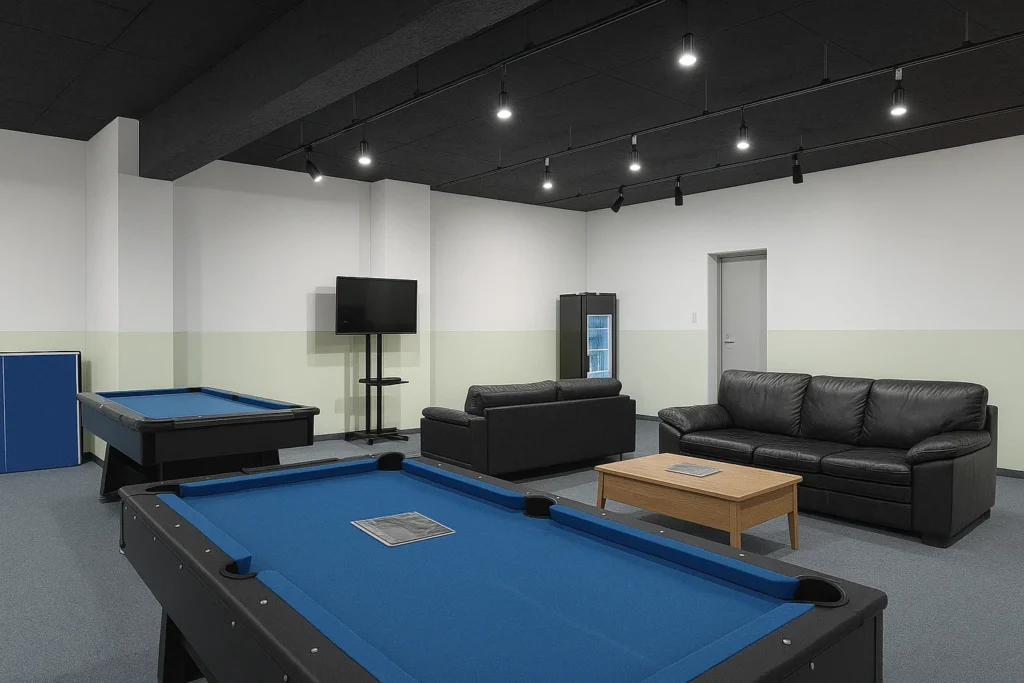 Console gaming room with sofas and large display at Uijeongbu Game Room